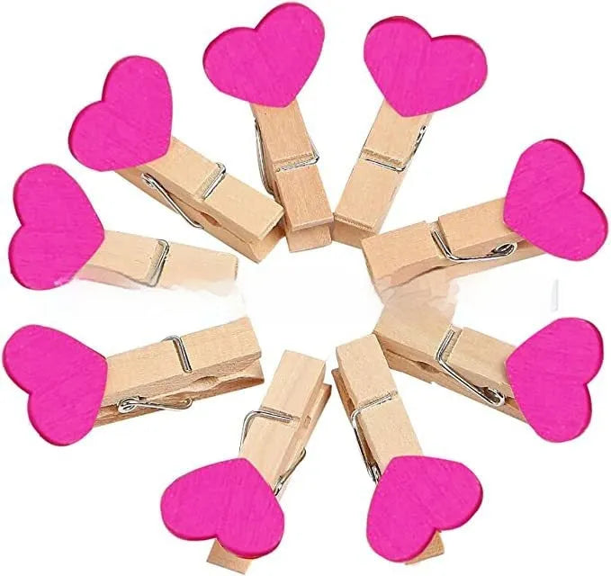 Five handmade wooden heart-shaped hair clips in red, pink, white, and yellow colours.