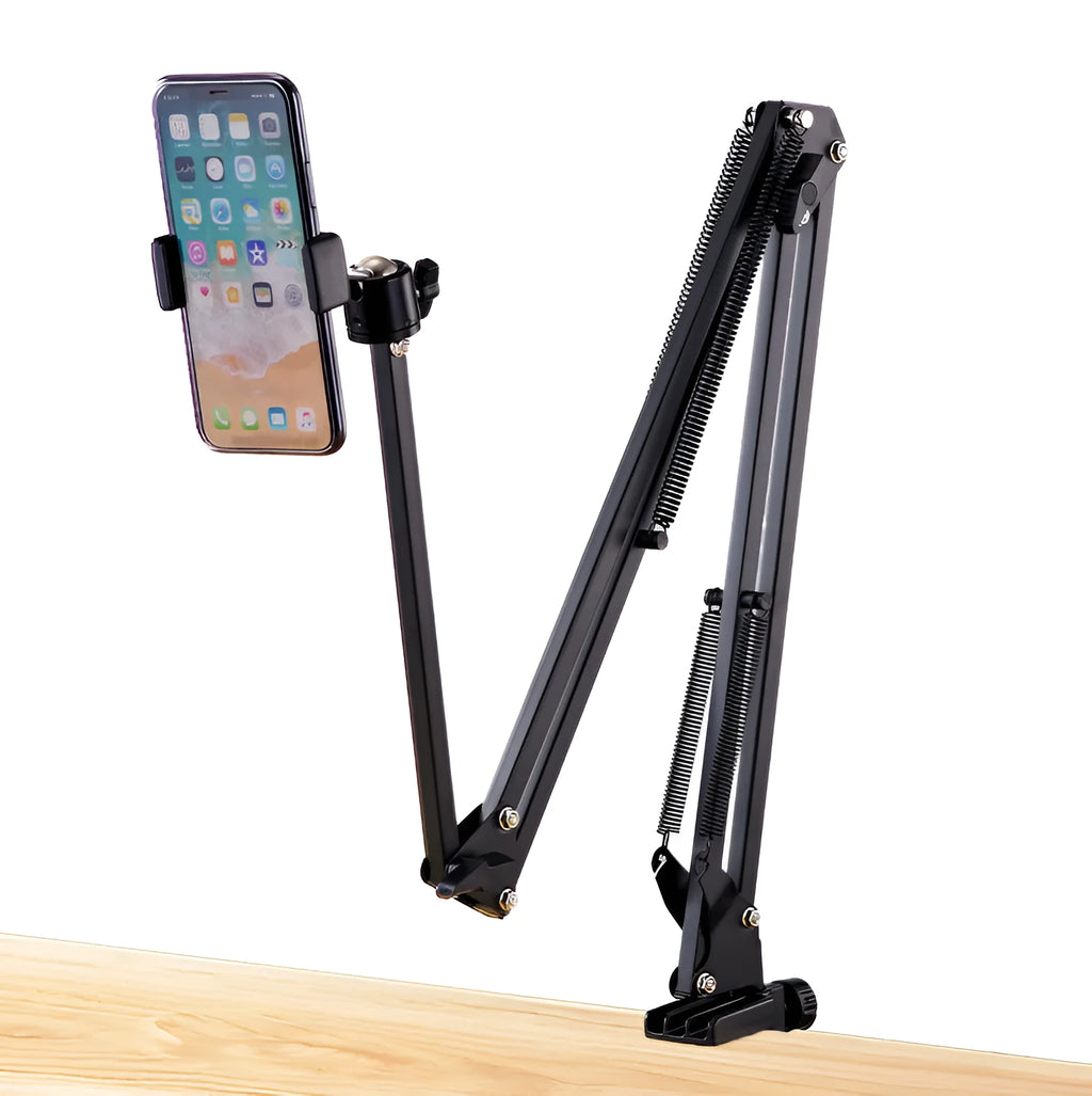 Black foldable metal cantilever bracket holding a tablet on a desktop, showing adjustable arms and clip.