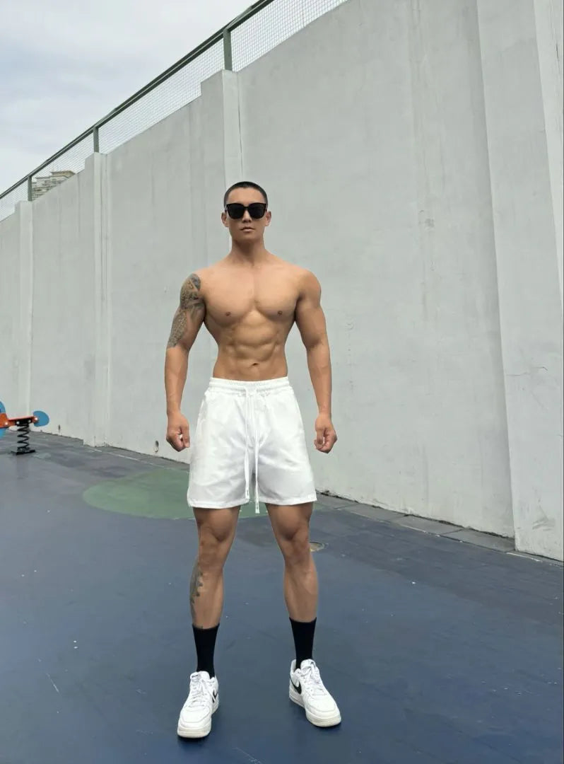 Men's ice silk quick-dry nylon shorts in light grey, showing double-layer casual fit.