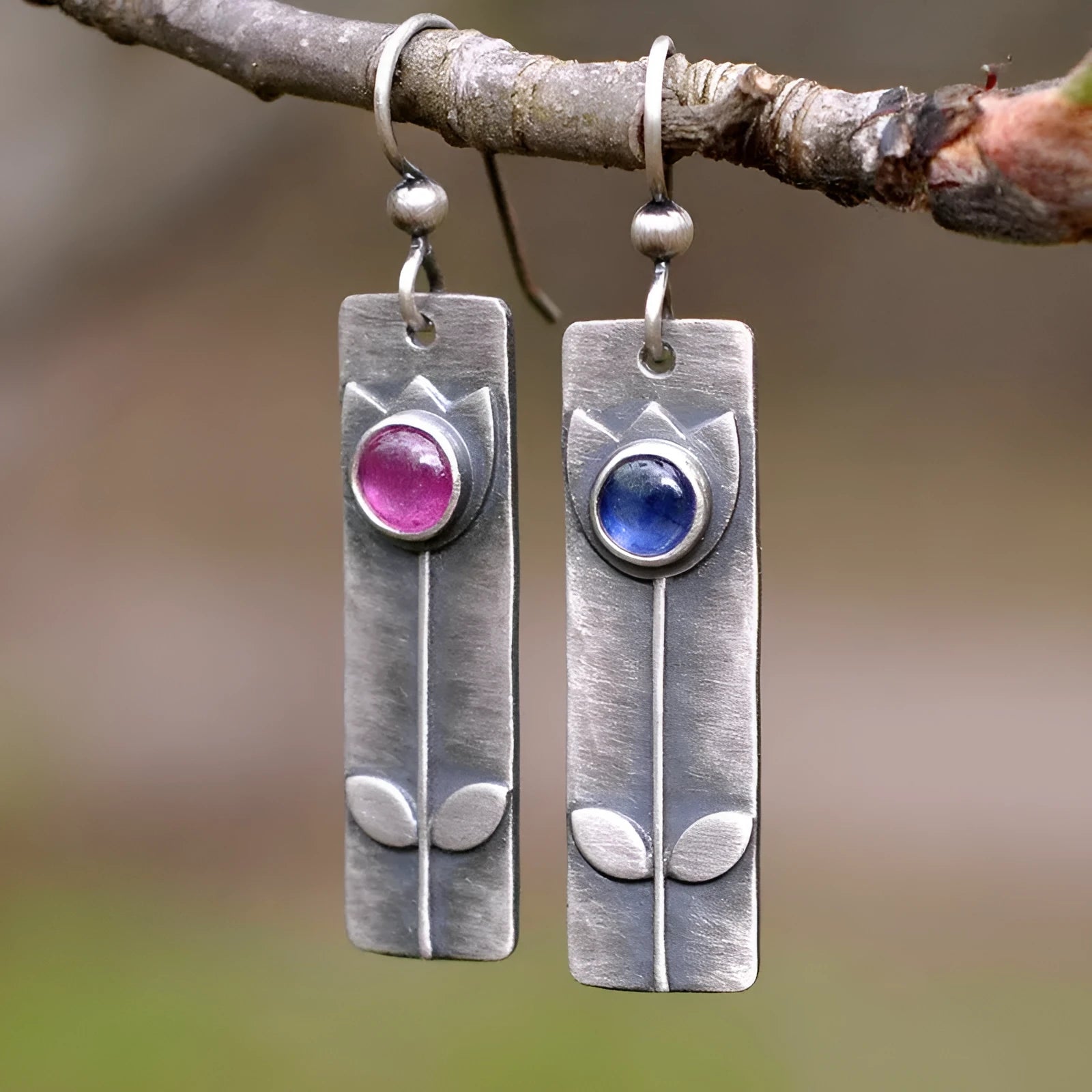 Antique finish geometric earrings with oval ellipse design and red sapphire accents