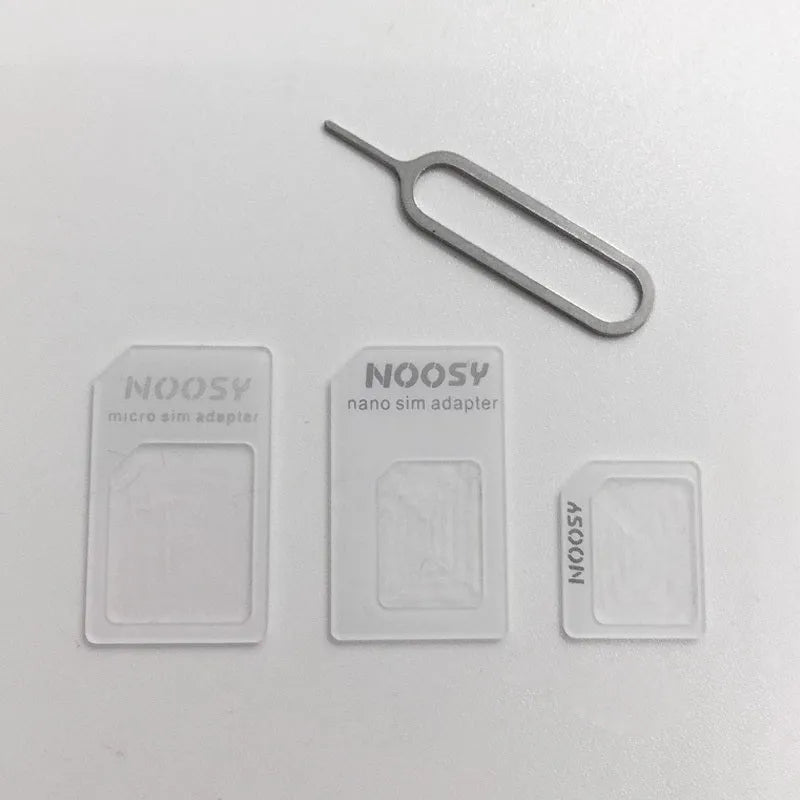 Four-in-one SIM restore kit showing three plastic SIM adapters and a metal pickup pin
