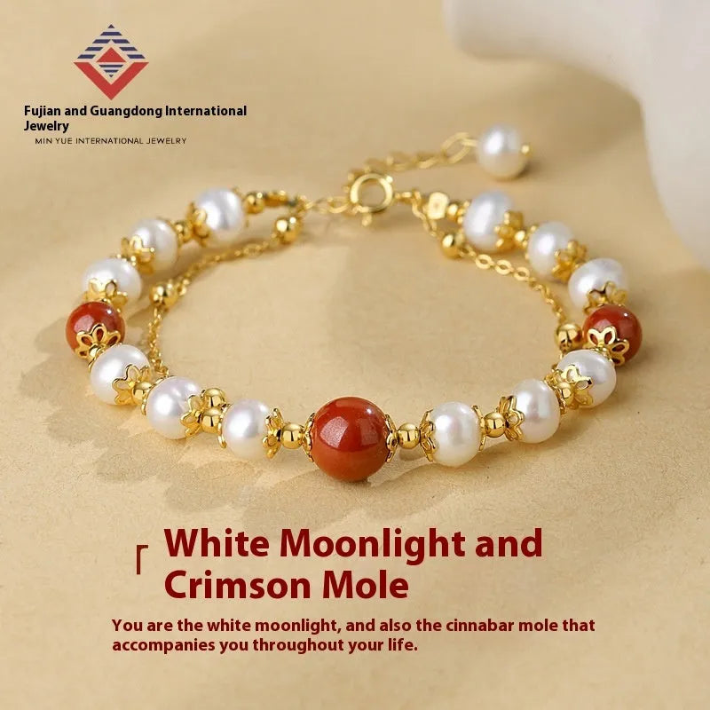 Sterling silver double-layer bracelet with white freshwater pearls and red cinnabar bean charms