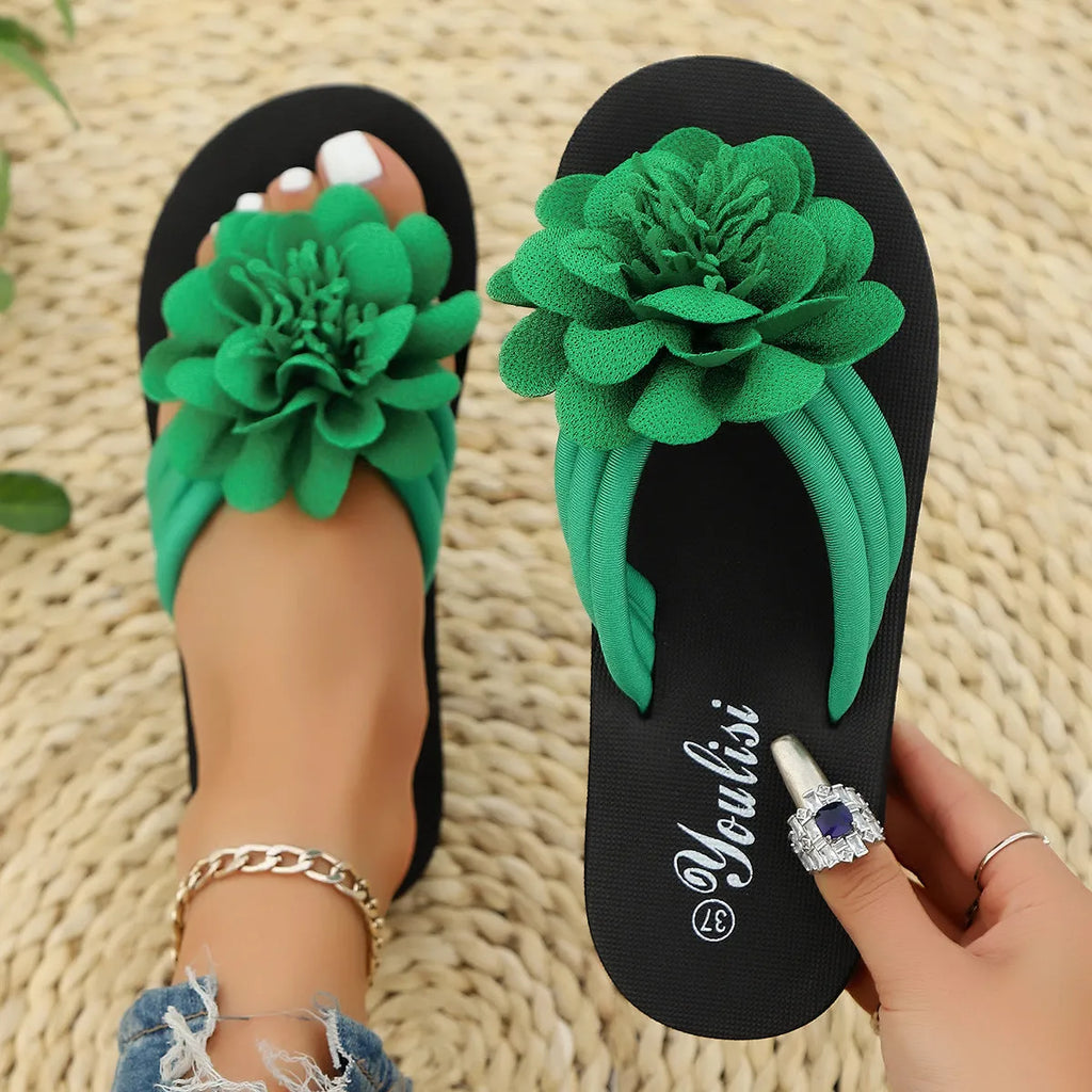 Solid-colour flower flip-flops in beige, red, black, or green with decorative flower design on EVA soles
