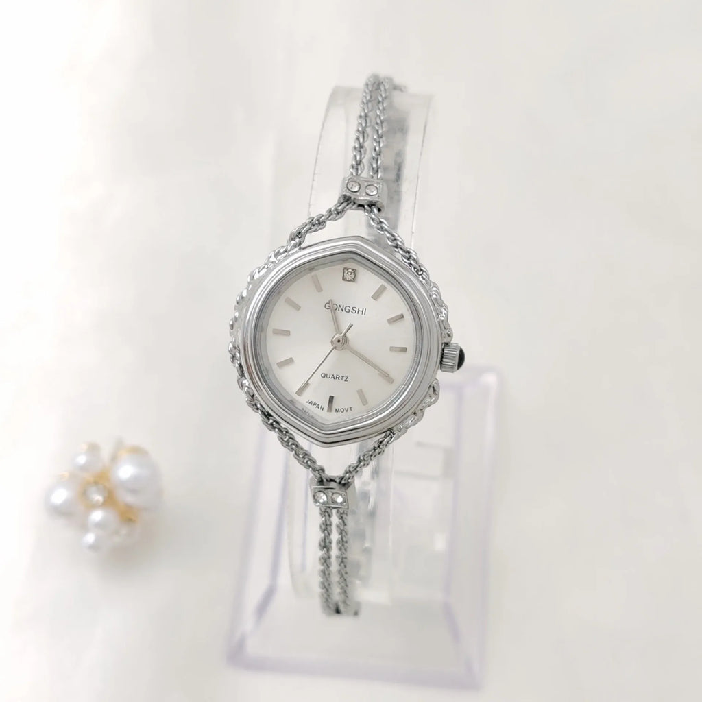 Ladies Mori-style quartz watch with 25mm dial on a metal chain strap in gold colour.