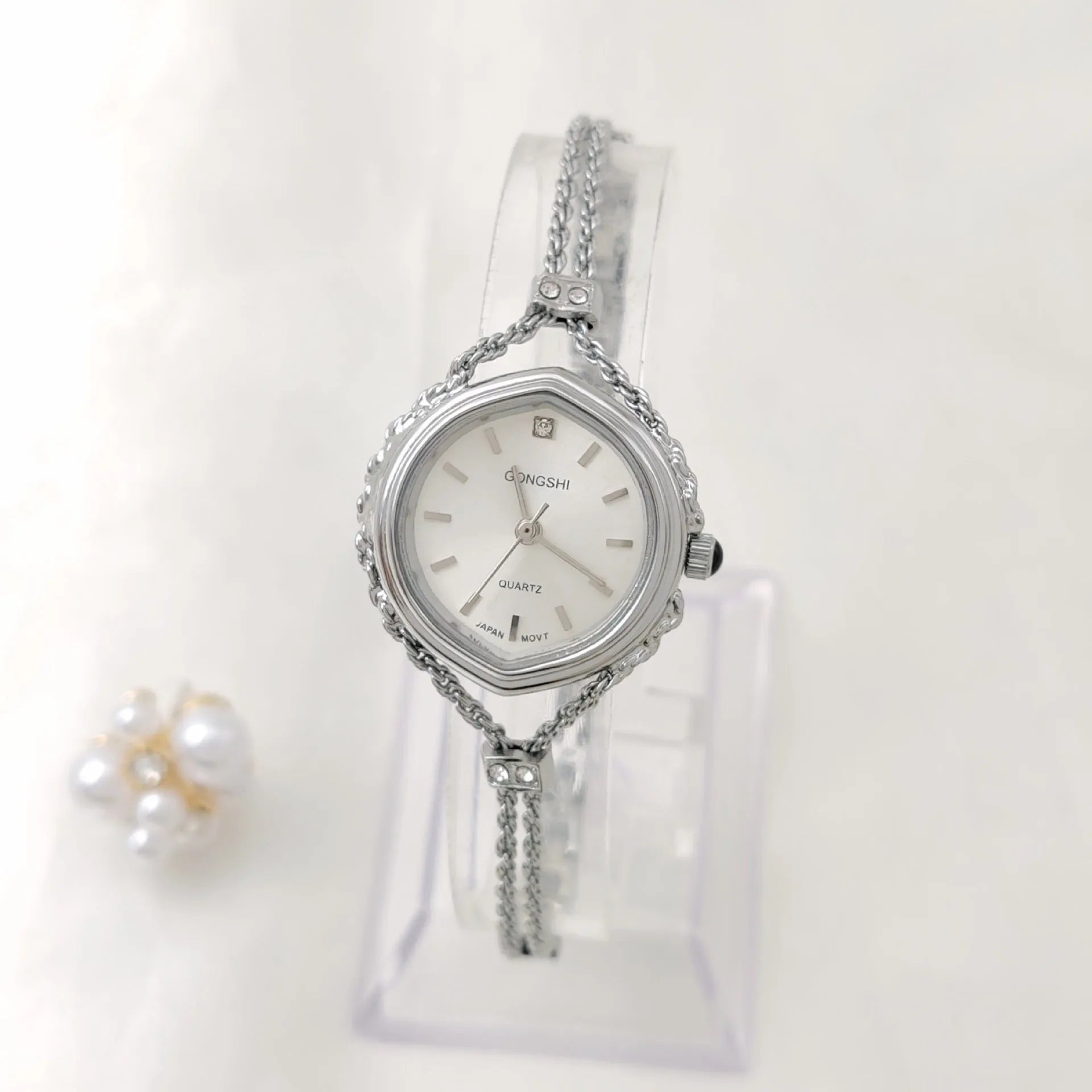 Ladies Mori-style quartz watch with 25mm dial on a metal chain strap in gold colour.