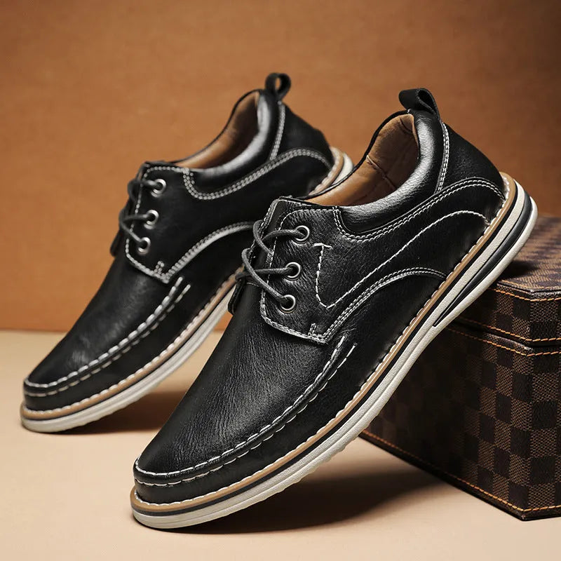 Men's black genuine leather lace-up casual shoes with round toe and rubber sole on a white background
