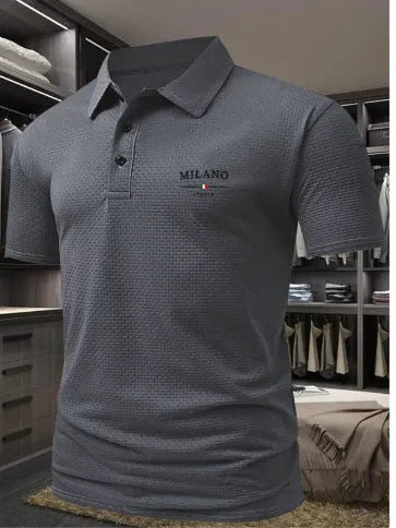 Men's loose fit short-sleeved lapel polo shirt in a solid colour on a model.