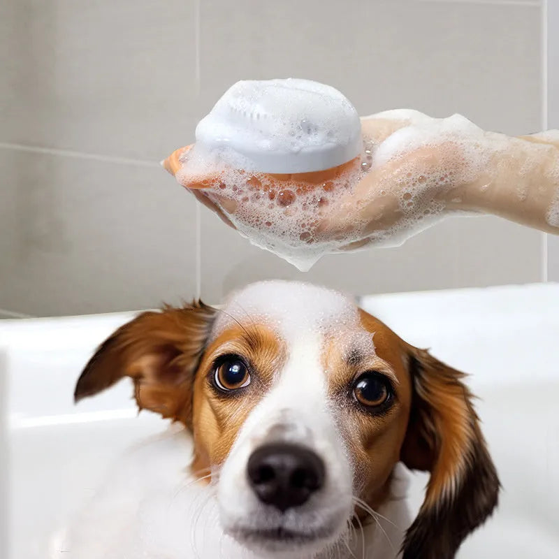 Orange TPR dog bath brush with shampoo dispenser and pumpkin-shaped grip