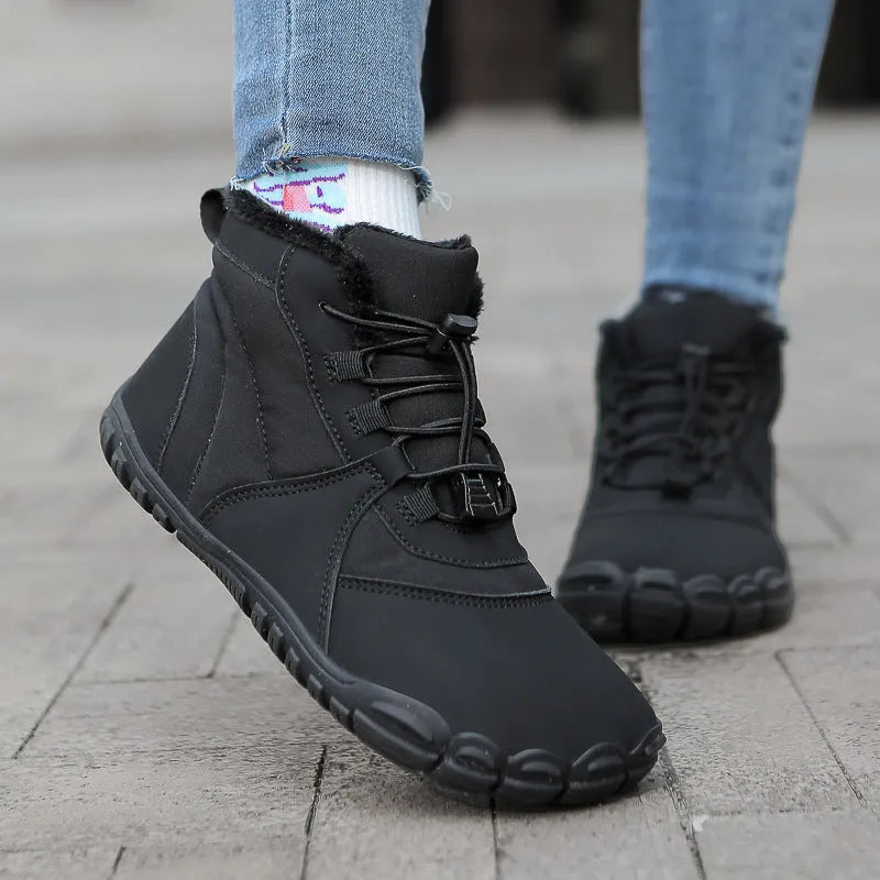 Unisex black waterproof snow boots with fleece lining and lace-up front on a rubber sole.