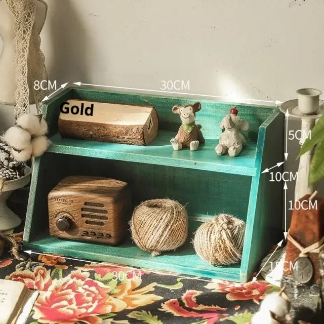Solid wood multi-layer cup storage box in blue finish, showing two tiers of cups organised neatly on a kitchen counter.