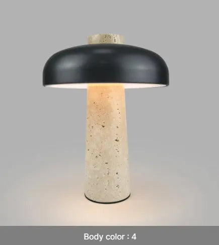 Modern alloy desk lamp with a rechargeable battery and touch-sensitive dimming switch on a wooden desk