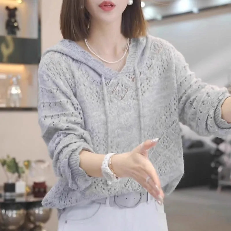 Lightweight crochet hooded longsuit undershirt for women in a solid colour, showing loose fit and long sleeves.