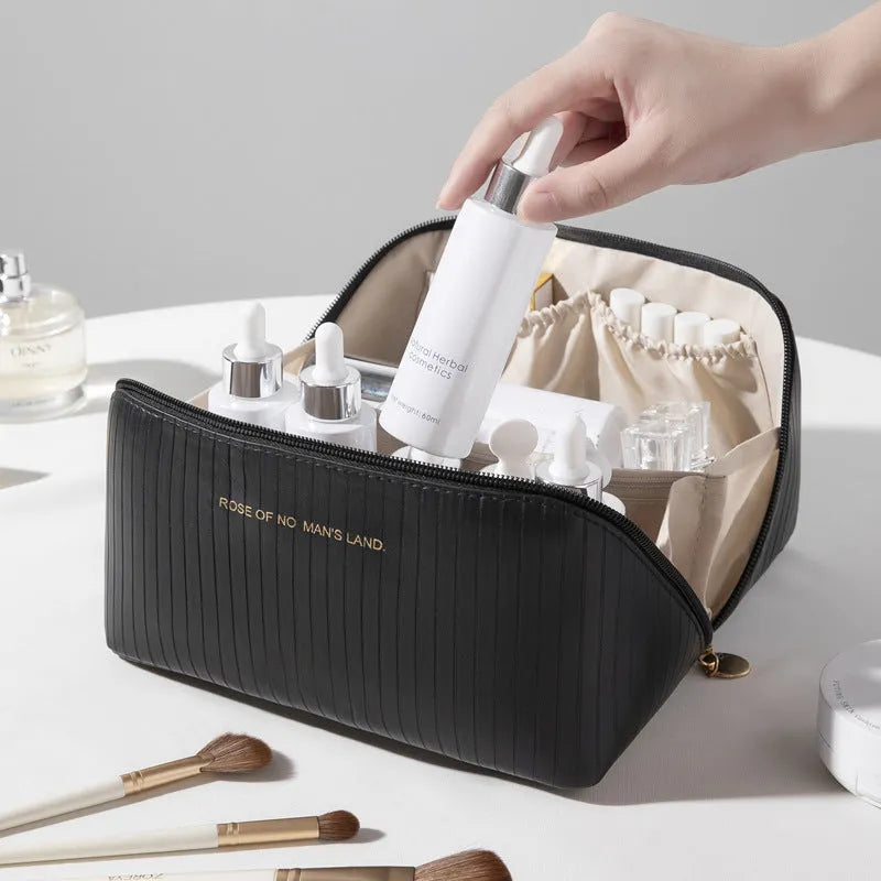 Vertical pattern cubic PU makeup bag in beige, showing large capacity for travel storage.