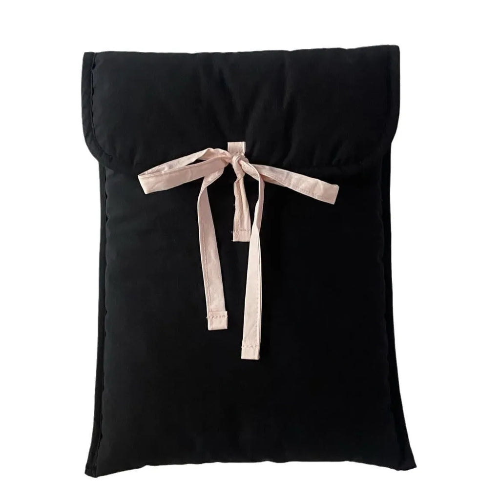Black and white striped quilted laptop bag with a ballet-style bow.