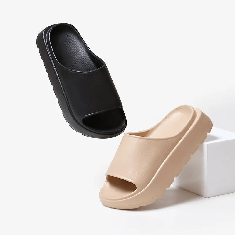 Women's beige fish mouth slippers with a thick 5.5cm EVA sole on a tiled floor.