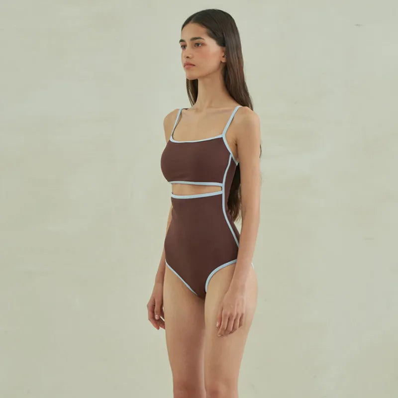 Brown triangle style one-piece swimsuit for women with sexy pattern