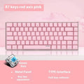 Pink mechanical gaming keyboard with 82 keys, white backlight, and metal construction on desk