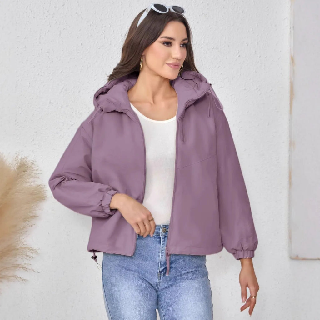 A woman's loose-fit hooded jacket in solid-colour polyester, shown in grey.
