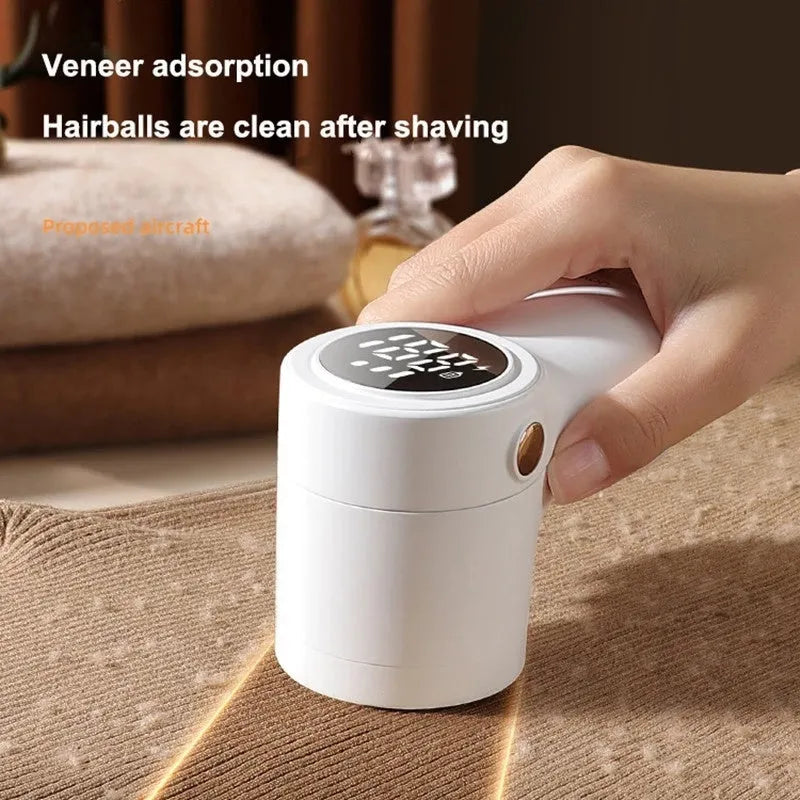 White electric lint remover with LED display and USB charging port for fabric hairball removal