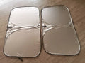 Titanium silver aluminium foil car sunshade folded, showing reflective surface and size options for windscreen protection.