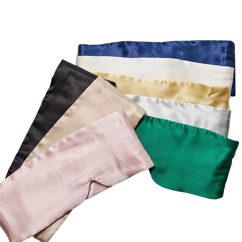 Silk sleep eye mask in multiple colours including black, champagne gold, and navy blue.