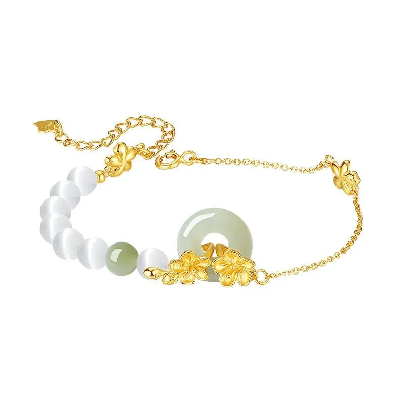 Women's pure silver safety buckle bracelet with peach blossom design in gold colour.
