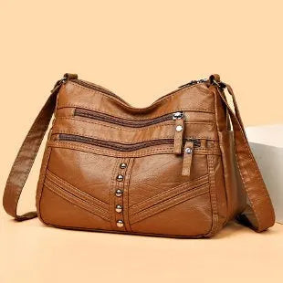 Ladies soft PU messenger bag in vintage style, available in black, brown, and red, horizontal square shape