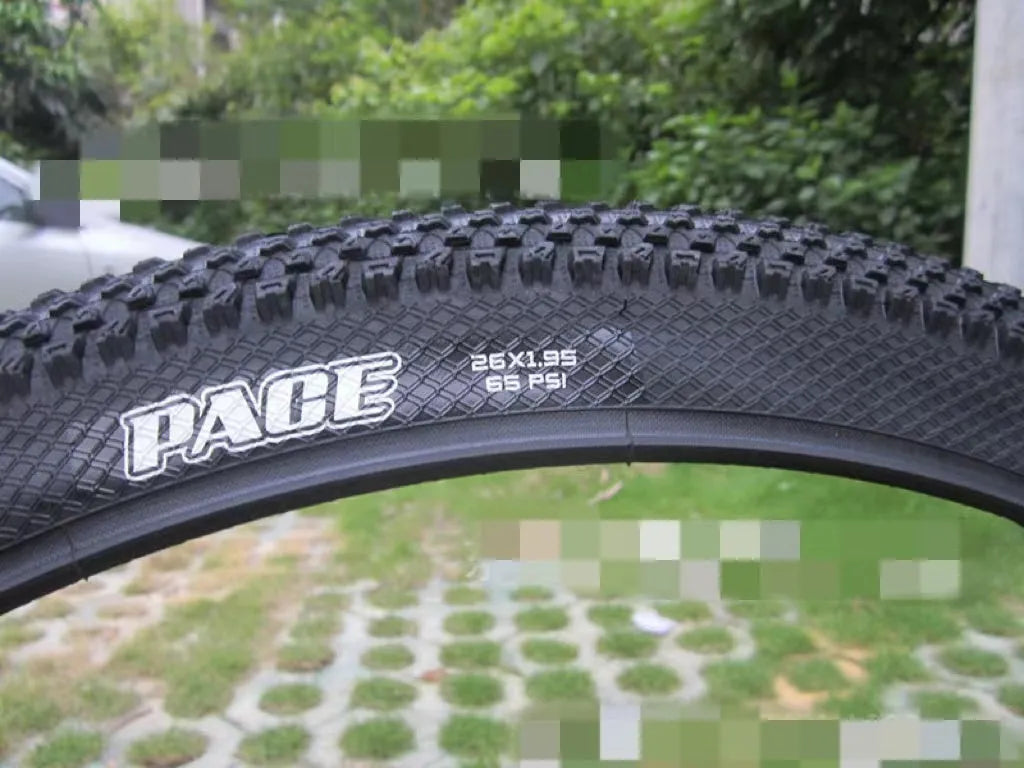 Ultralight puncture proof mountain bike tyre shown in 26, 27.5, and 29 inch sizes with black and white label sidewall options.