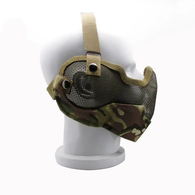 Carbon steel field protective mask with head mount in camouflage pattern, shown with attached mouth muffler.