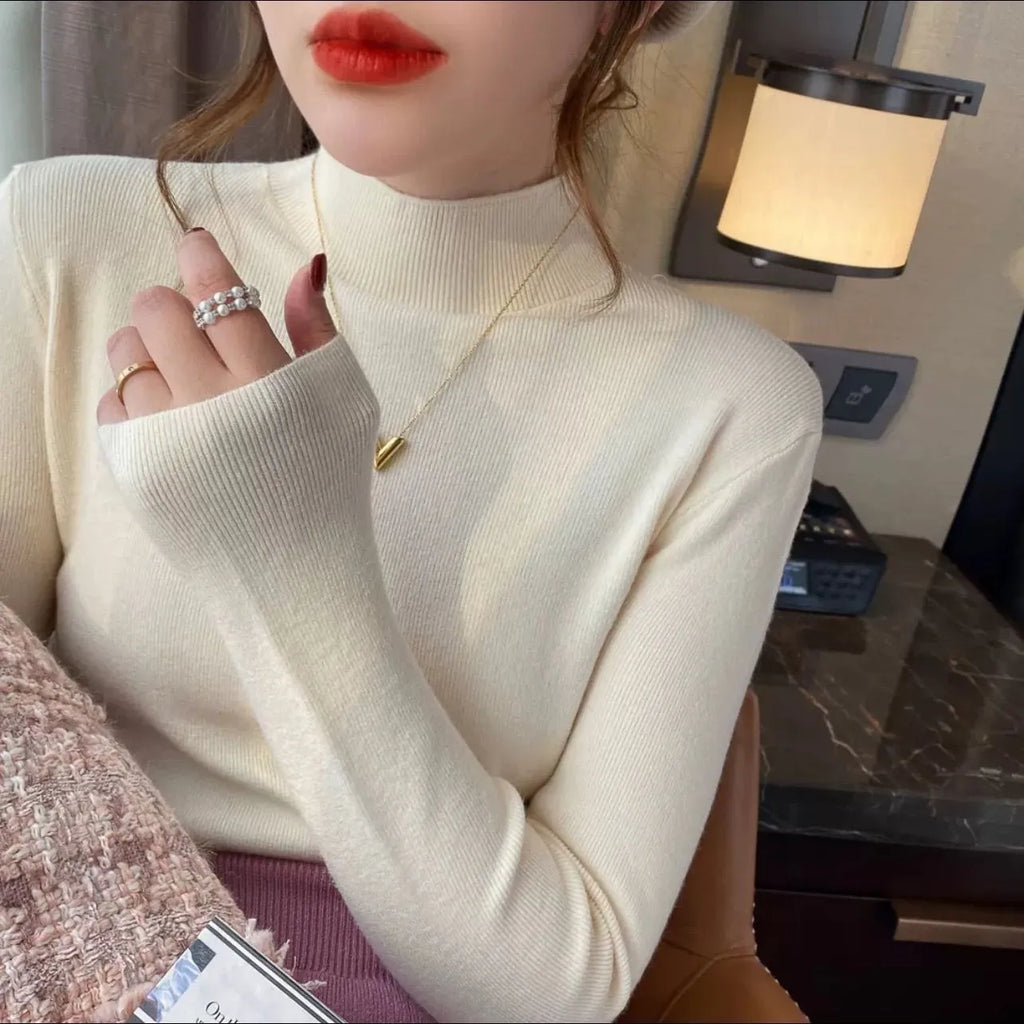 Slim fit knitted viscose bottoming shirt in apricot colour with long sleeves.