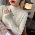 Slim fit knitted viscose bottoming shirt in apricot colour with long sleeves.
