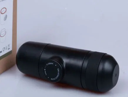 Black portable manual espresso machine showing 6cm diameter and 17.5cm height with stainless steel and plastic components.