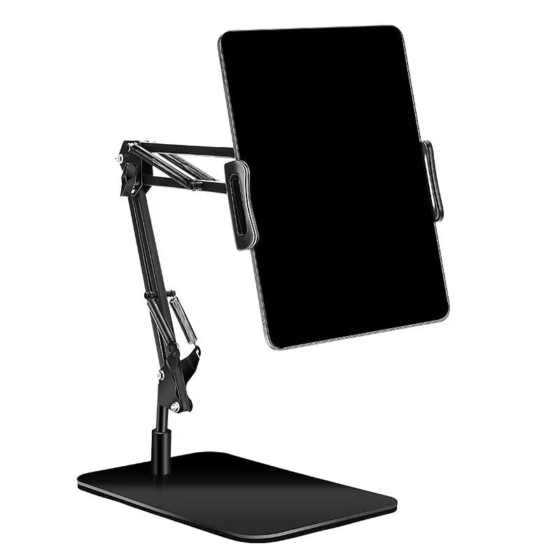 Black universal phone stand with long metal arm and circular base on a wooden desk