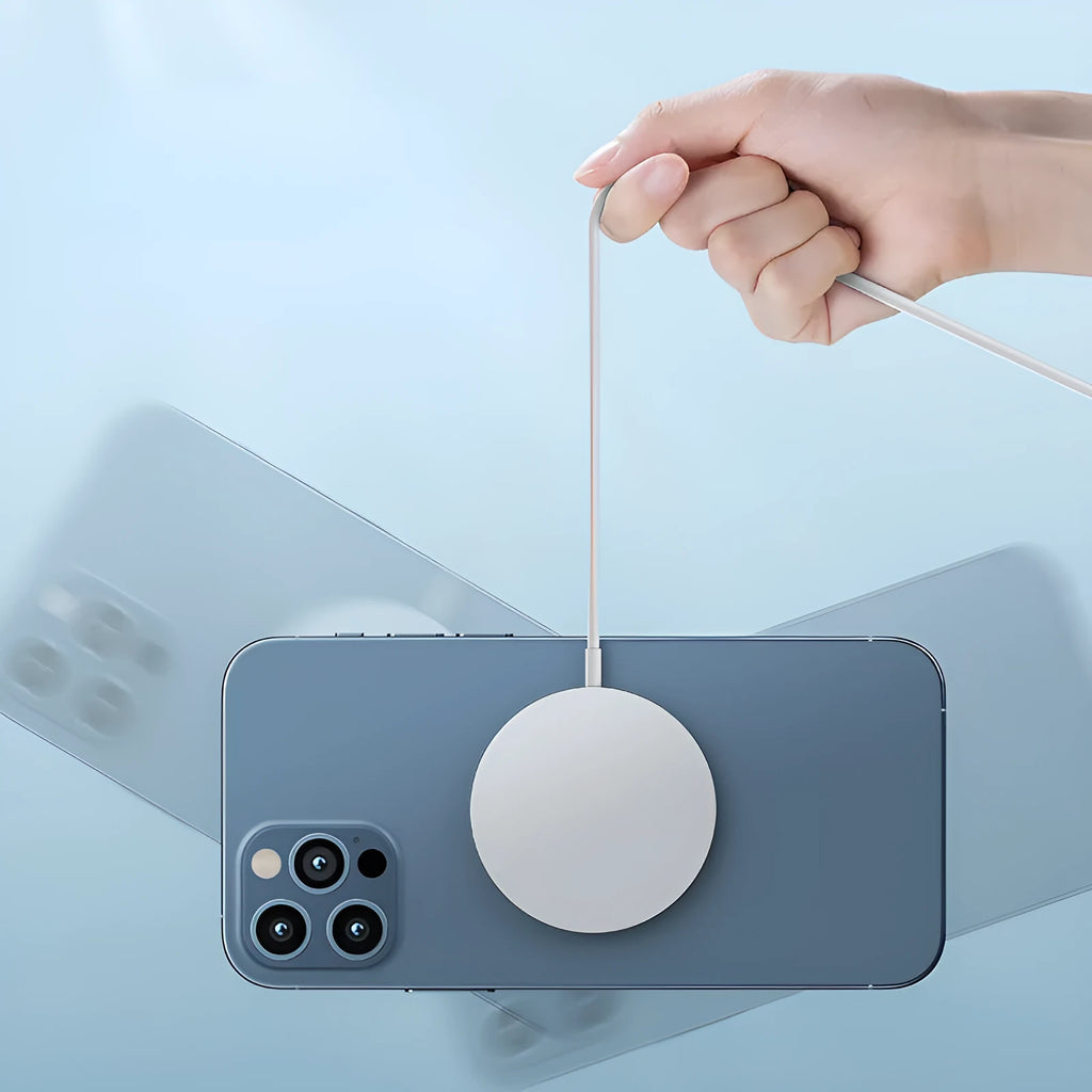 Round 15W magnetic wireless charger disc in white, black, and transparent finishes on a desk