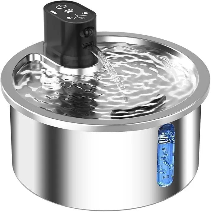 Stainless steel cat water fountain with heating base on a table.