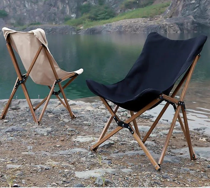 Folding camping chair with wood grain aluminium frame, rotating seat, and handrails in khaki colour