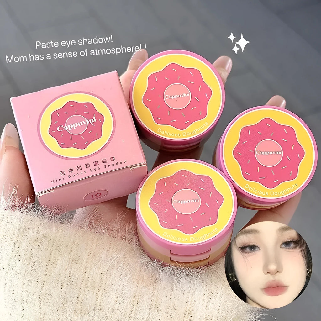 Mini donut eye shadow palette with three pink and brown shades in a thin compact