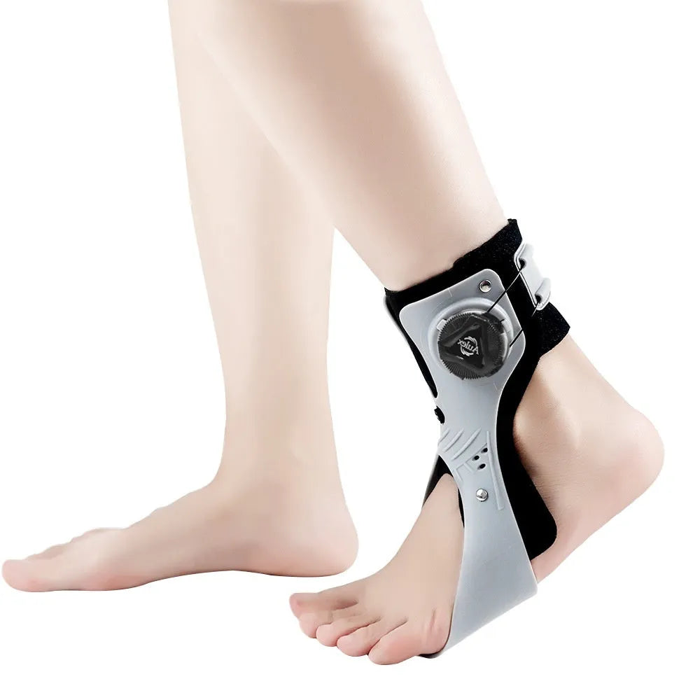 Grey ankle support brace with airbag button compression system showing adjustable fastening