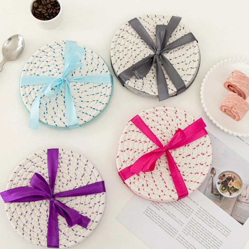 Three round cotton cord coasters in blue colour with modern simplicity design