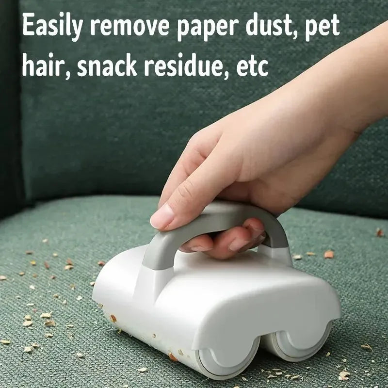 Green pet hair removal roller with handle and double rollers on a white background