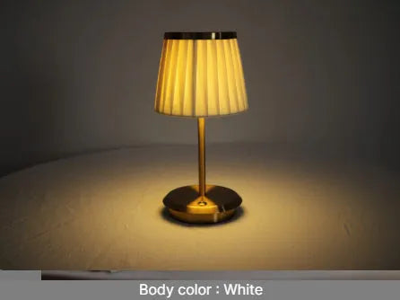 Gold alloy desk lamp with 3W LED light head and Type-C charging port on a wooden desk