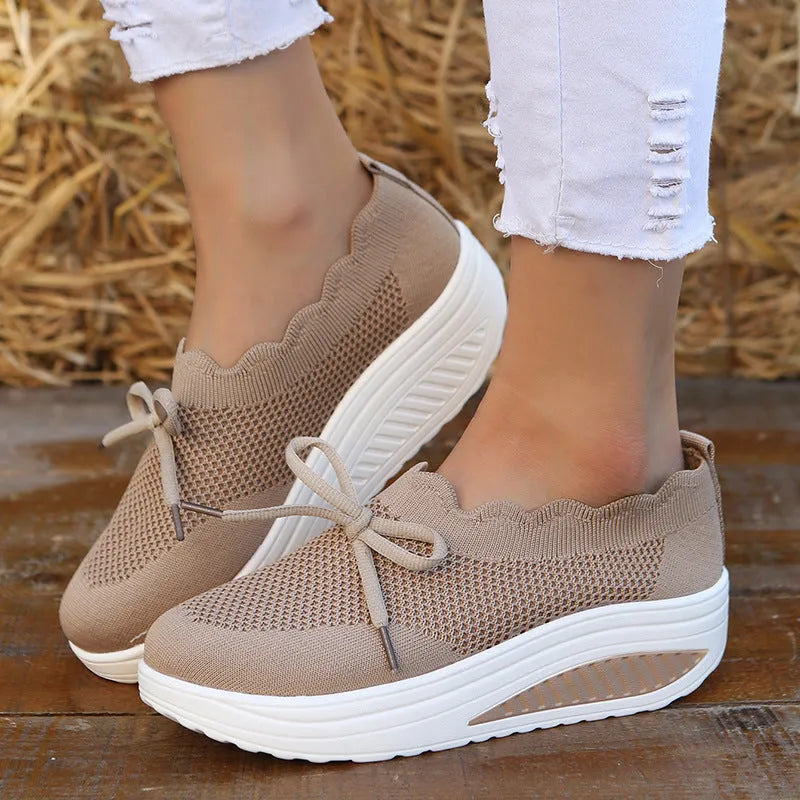 Women's fly-knit mesh sneakers in black with round toe and mid heel, fabric upper