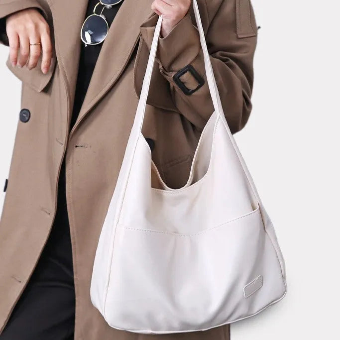Women's soft square PU shoulder bag in retro style with open pocket and single strap.