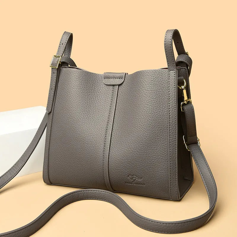 Ladies retro shoulder bag in vertical square shape showing PU material construction and internal compartments