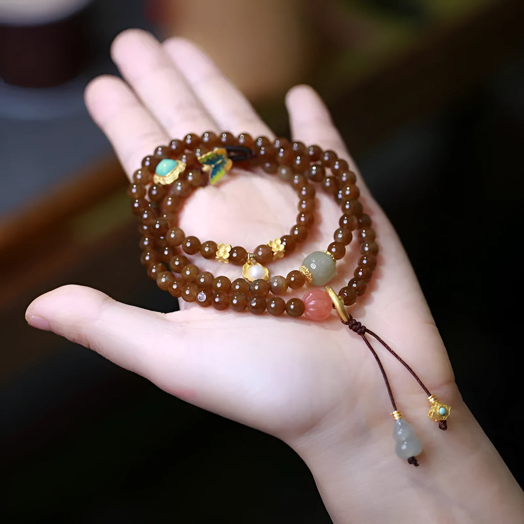 Brown jade Hetian jade three-ring bracelet with butterfly and gourd pearl design