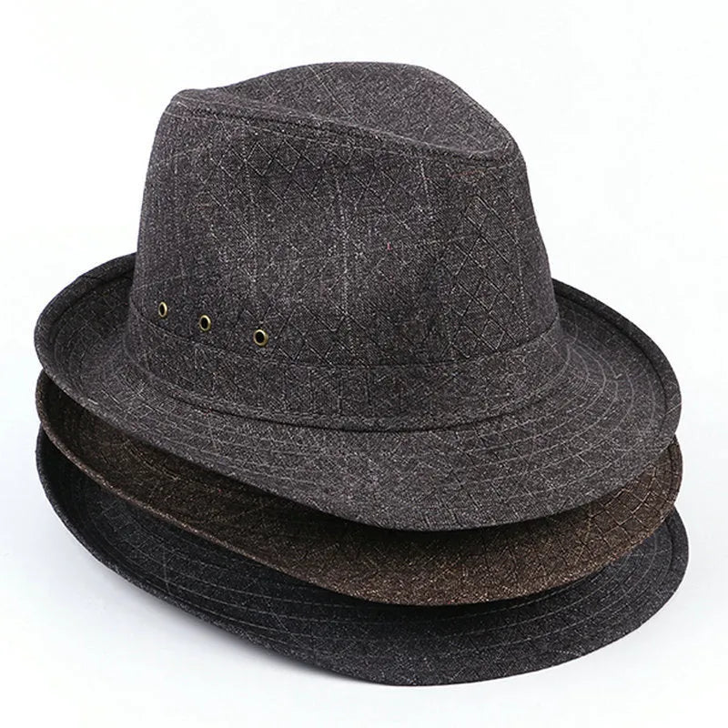 A classic brown fedora hat for men on a wooden stand, showing its structured crown and medium-width brim.