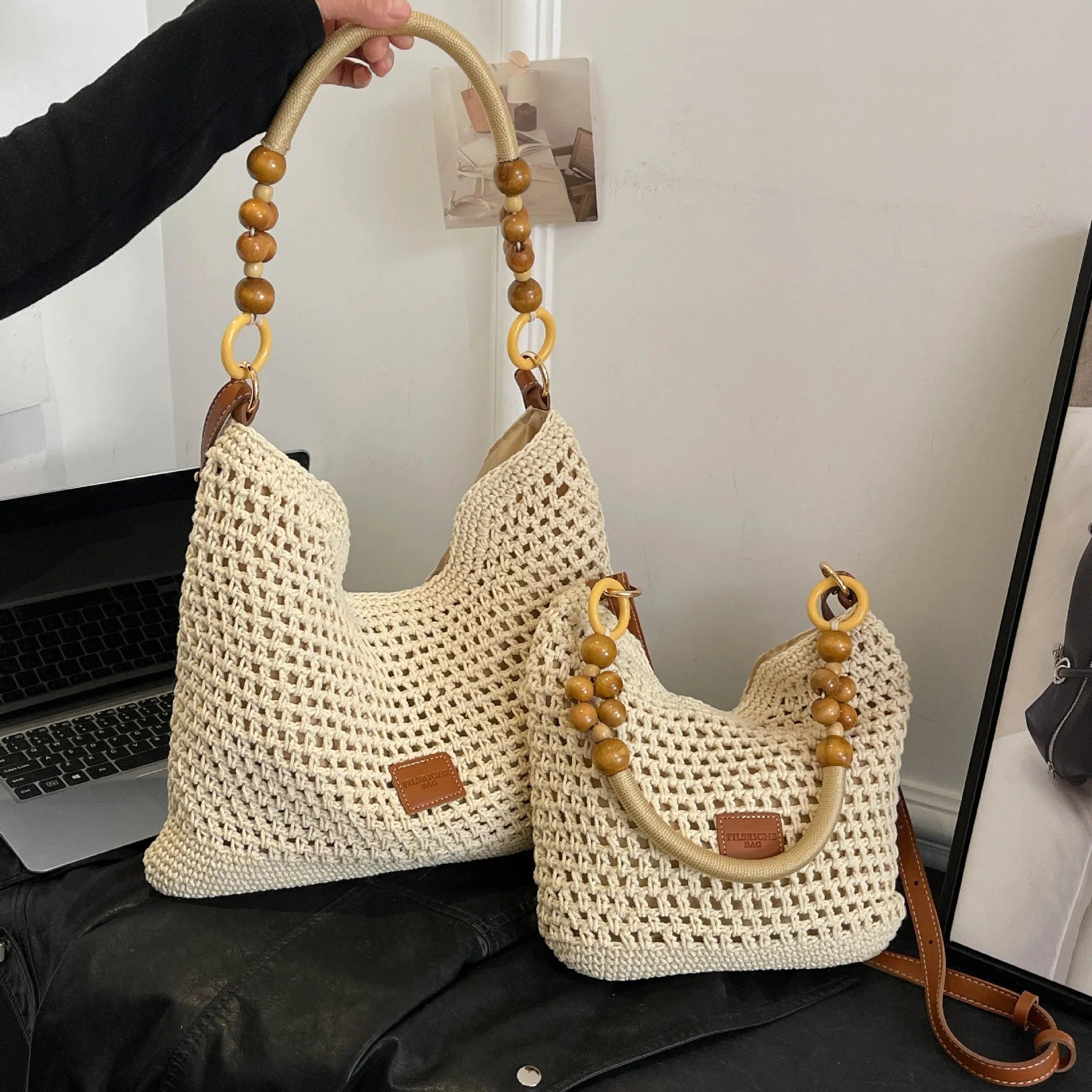 Knitted bucket tote beach bag in black or brown with contrast stitching and crossbody strap