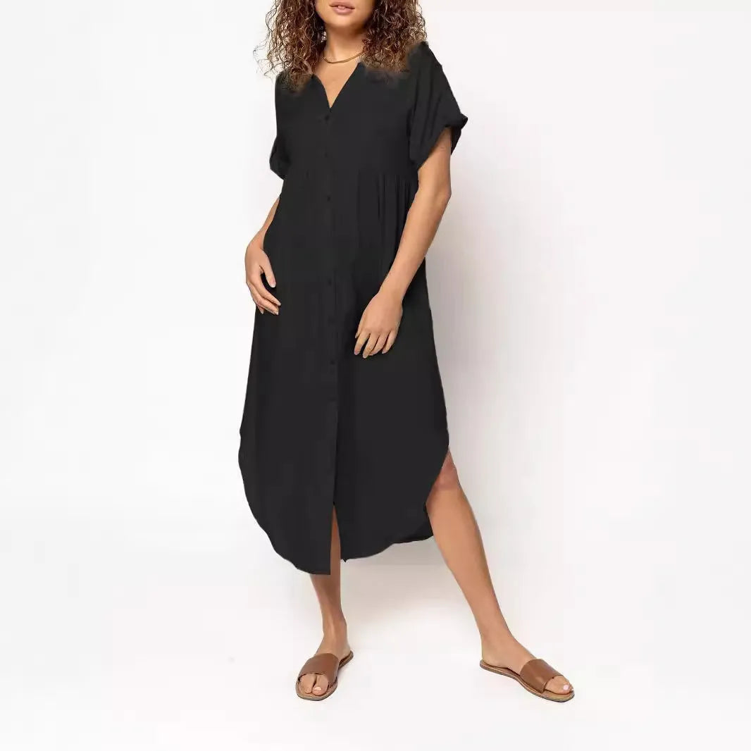 A loose-fitting mid-length casual dress with a button-down front, shown in a solid colour.