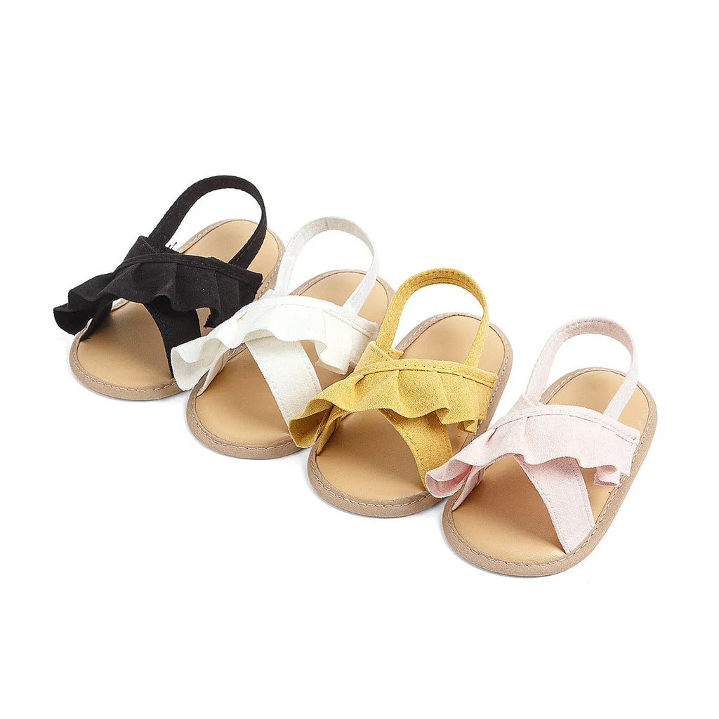 Baby girl toddler shoes with soft bottom, lace, and Velcro closure in white cotton cloth, side view