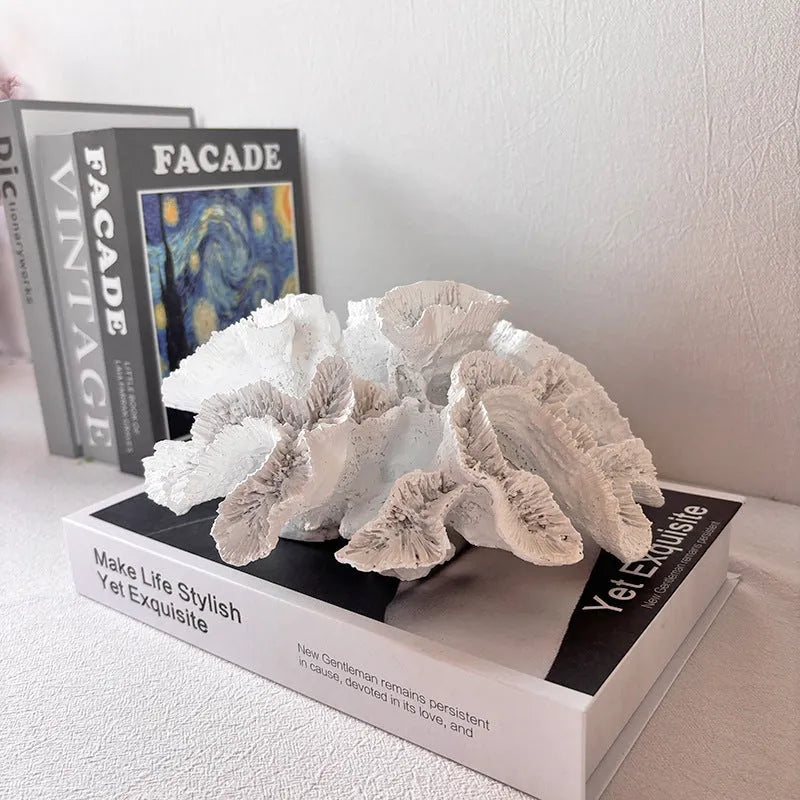 Off-white geometry coral ornament made from synthetic resin on a shelf